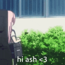 a girl with pink hair is standing in front of a bush and a window .