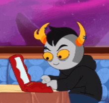 a cartoon character is sitting at a table using a red laptop computer .