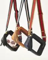 a clear purse with a tassel and a strap that says r.i.s.l.