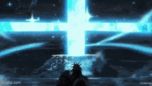 a statue of liberty stands in front of a large blue light