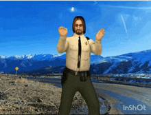 a man in a sheriff 's uniform is dancing in front of a snowy mountain range