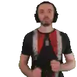 a man wearing headphones and a black shirt is dancing