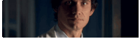 a close up of a man 's face in a dark room .