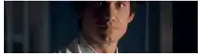 a close up of a man 's face in a dark room .
