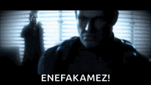 a man standing in front of a window with the words enefakamiz on the bottom right