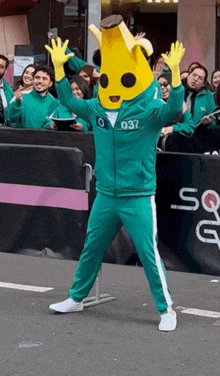 a person dressed as a banana with the number 037 on the front