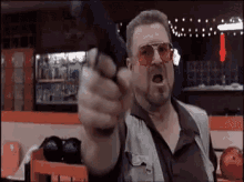 The Big Lebowski Gun GIF - John Goodman Angry GIFs