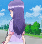 a girl with long purple hair is walking down the street
