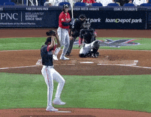 a baseball game is being played in front of a sign that says pnc