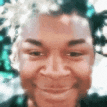 a blurry picture of a person 's face with a smile on it