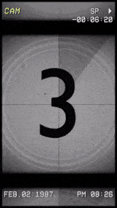 a countdown clock shows the number 3 and the date feb 02 1987
