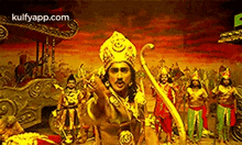 a man is holding a bow and arrow in front of a group of people .