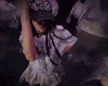 a girl wearing a hat that says " 808 "