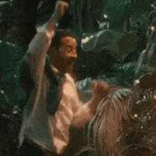 a painting of a man riding a horse with his fist in the air