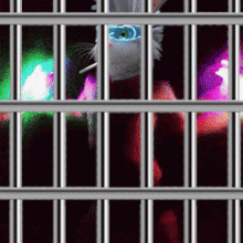 a pixelated image of a person behind bars with a glowing eye