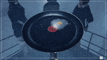 a person holding a frying pan with a fried egg in it