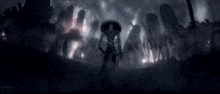 a group of people are standing in a dark room with a lot of lights coming out of it .