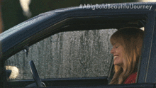 a picture of a woman in a car with a big bold beautiful journey written on it