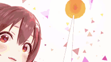 a girl with red hair is looking up at a white object