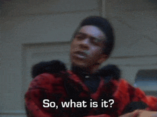 a man in a red fur coat is asking " so what is it "