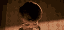 a close up of a cartoon character 's face with a black spot on his face .