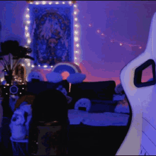 a room with purple lights and a white chair in the foreground