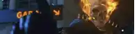 a ghost rider is standing in front of a garage sign .