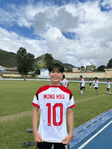 a young man wearing a jersey with the number 10 on it