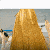a woman with long blonde hair is getting her hair done