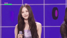 two girls singing into microphones with the show written on the bottom