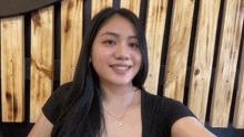 a woman with braces on her teeth is smiling
