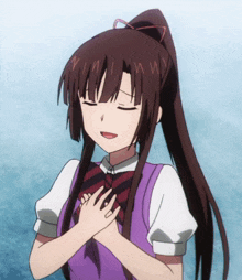 a girl with a ponytail is smiling with her eyes closed and her hands on her chest