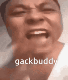 a close up of a person 's face with the words gackbuddy written on the bottom