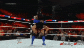 Roman Reigns Spear Batista Payback GIF - Roman Reigns Spear Batista Payback GIFs