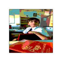 a boy sits at a desk in front of a book that says bridge