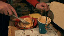 a person is spreading butter on a piece of toast