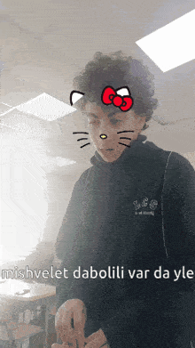 a person with a hello kitty face and the words " ishvelet dabolili var da yk " on the bottom