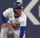 a blue jays baseball player with a td bank patch on his arm