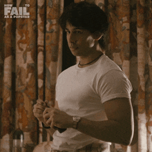 a man in a white shirt is standing in front of a curtain with the words how to fail as a popstar on the bottom