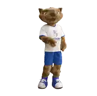 a mascot wearing a white shirt that says niños