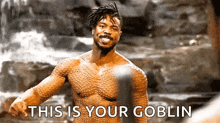 a man without a shirt is standing in front of a waterfall and says `` this is your goblin '' .