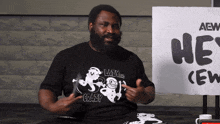 a man wearing a black shirt that says crazy on it