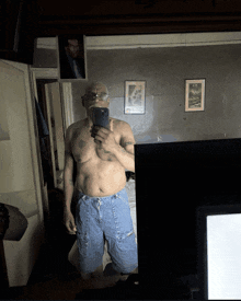 a man taking a selfie in front of a mirror