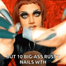 a picture of a drag queen with the caption but 10 big ass rusty nails wth