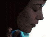 a woman 's face is shown in a close up with her eyes closed