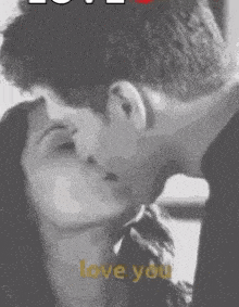 a black and white photo of a man and woman kissing with the words " i love you " written below them
