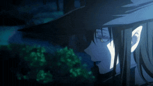 a close up of a person 's face with a witch hat on
