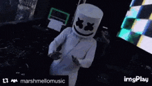 a man is wearing a marshmallow hat and dancing in a club .