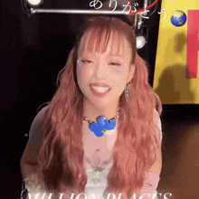 a woman with pink hair and a necklace that says million places on it