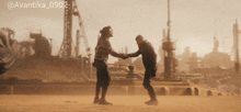 two men shaking hands in a field with the hashtag @avantika_0902